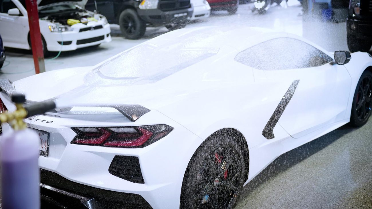Rear three-quarter view of a white Chevrolet Corvette